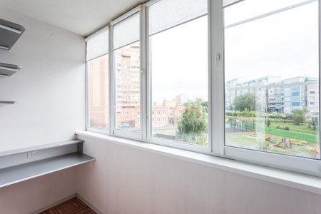 the balcony of an apartment on the upper floors of an apartment buildingの写真素材