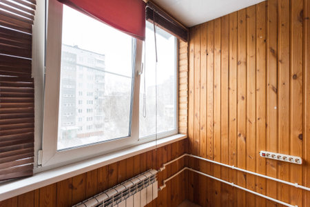 the balcony of an apartment on the upper floors of an apartment buildingの写真素材