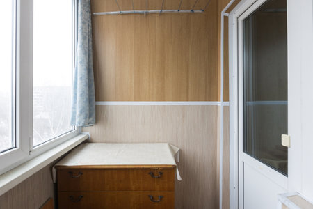 the balcony of an apartment on the upper floors of an apartment buildingの写真素材