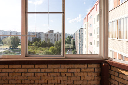 the balcony of an apartment on the upper floors of an apartment buildingの写真素材
