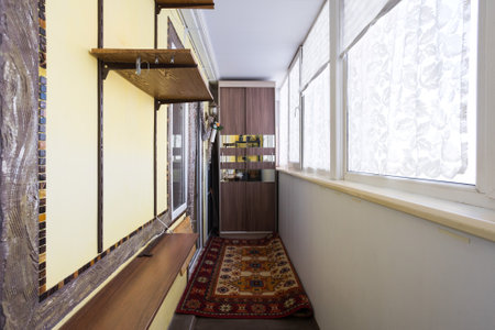 the balcony of an apartment on the upper floors of an apartment buildingの写真素材