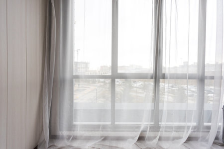 the balcony of an apartment on the upper floors of an apartment buildingの写真素材