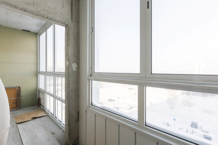 the balcony of an apartment on the upper floors of an apartment buildingの写真素材