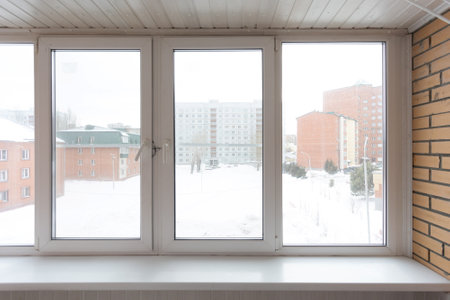 the balcony of an apartment on the upper floors of an apartment building