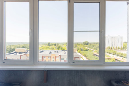the balcony of an apartment on the upper floors of an apartment building