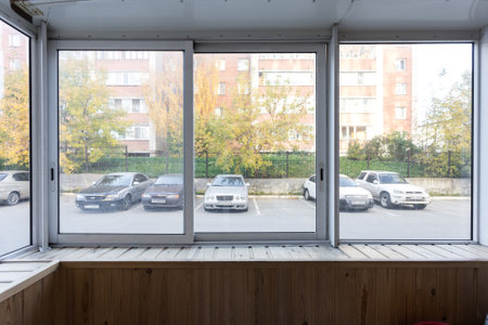 the balcony of an apartment on the upper floors of an apartment buildingの写真素材