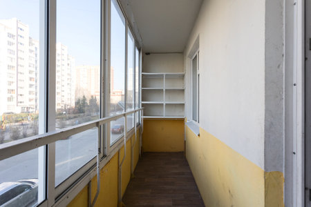 the balcony of an apartment on the upper floors of an apartment buildingの写真素材