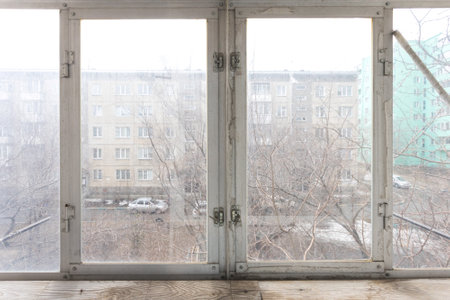 the balcony of an apartment on the upper floors of an apartment buildingの写真素材