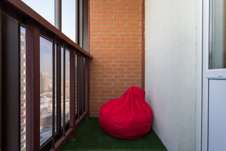 the balcony of an apartment on the upper floors of an apartment buildingの写真素材