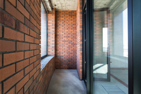 the balcony of an apartment on the upper floors of an apartment buildingの写真素材