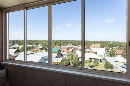 the balcony of an apartment on the upper floors of an apartment buildingの写真素材
