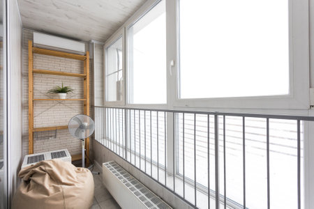 the balcony of an apartment on the upper floors of an apartment buildingの写真素材