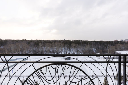the balcony of an apartment on the upper floors of an apartment buildingの写真素材