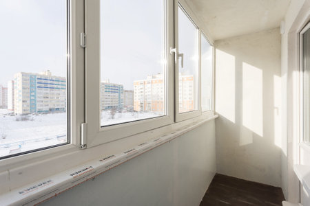 the balcony of an apartment on the upper floors of an apartment buildingの写真素材