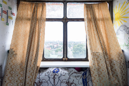 the balcony of an apartment on the upper floors of an apartment buildingの写真素材