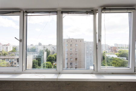 the balcony of an apartment on the upper floors of an apartment buildingの写真素材