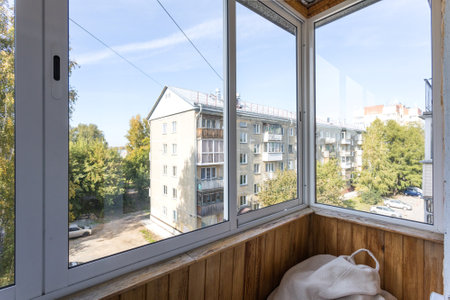 the balcony of an apartment on the upper floors of an apartment buildingの写真素材