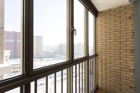 the balcony of an apartment on the upper floors of an apartment buildingの写真素材