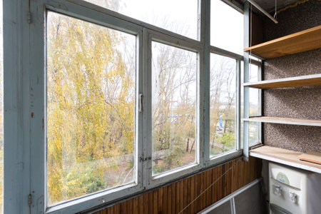 the balcony of an apartment on the upper floors of an apartment buildingの写真素材