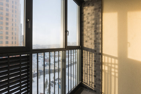 the balcony of an apartment on the upper floors of an apartment buildingの写真素材