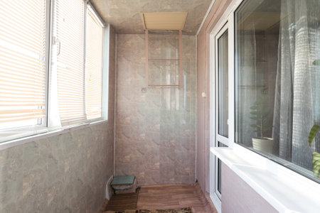 the balcony of an apartment on the upper floors of an apartment buildingの写真素材