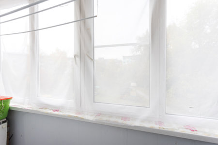 the balcony of an apartment on the upper floors of an apartment buildingの写真素材