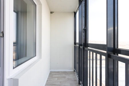 the balcony of an apartment on the upper floors of an apartment buildingの写真素材
