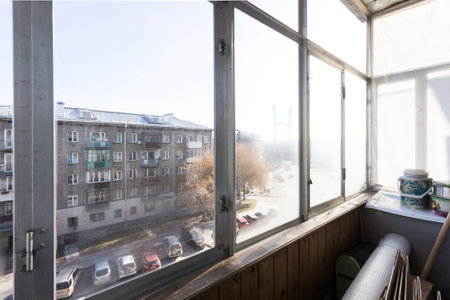 the balcony of an apartment on the upper floors of an apartment buildingの写真素材