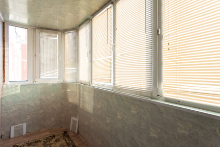 the balcony of an apartment on the upper floors of an apartment buildingの写真素材