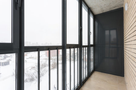 the balcony of an apartment on the upper floors of an apartment buildingの写真素材