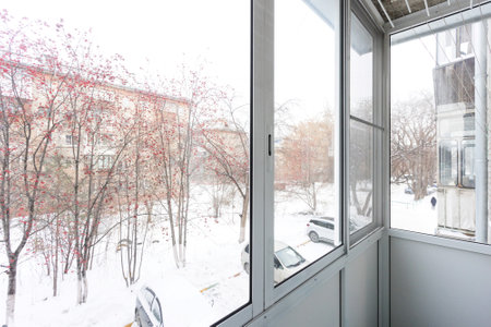 the balcony of an apartment on the upper floors of an apartment buildingの写真素材