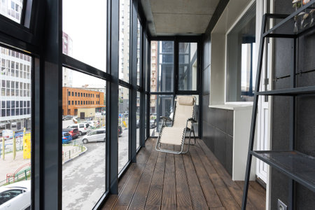 the balcony of an apartment on the upper floors of an apartment buildingの写真素材