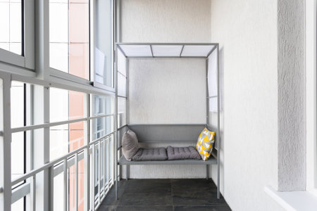 the balcony of an apartment on the upper floors of an apartment buildingの写真素材