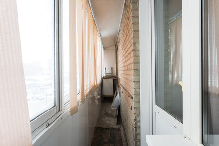 the balcony of an apartment on the upper floors of an apartment buildingの写真素材