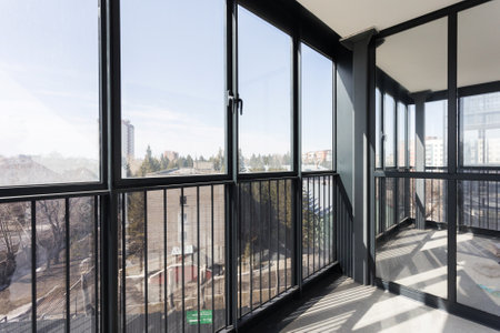 the balcony of an apartment on the upper floors of an apartment buildingの写真素材