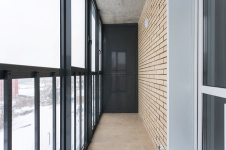 the balcony of an apartment on the upper floors of an apartment buildingの写真素材