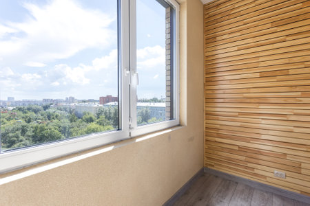 the balcony of an apartment on the upper floors of an apartment buildingの写真素材