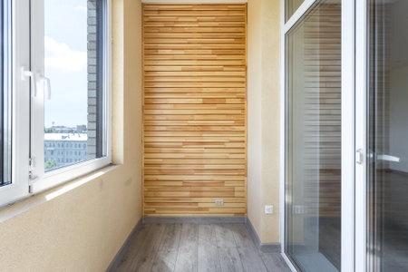 the balcony of an apartment on the upper floors of an apartment buildingの写真素材