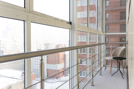 the balcony of an apartment on the upper floors of an apartment buildingの写真素材