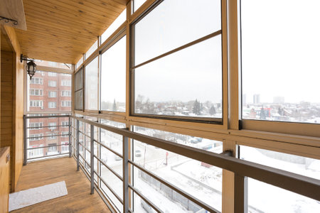 the balcony of an apartment on the upper floors of an apartment buildingの写真素材