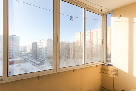 the balcony of an apartment on the upper floors of an apartment buildingの写真素材