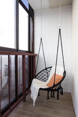 the balcony of an apartment on the upper floors of an apartment buildingの写真素材