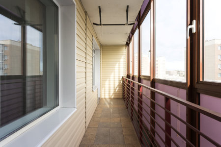 the balcony of an apartment on the upper floors of an apartment buildingの写真素材