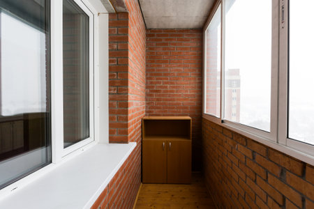 the balcony of an apartment on the upper floors of an apartment buildingの写真素材
