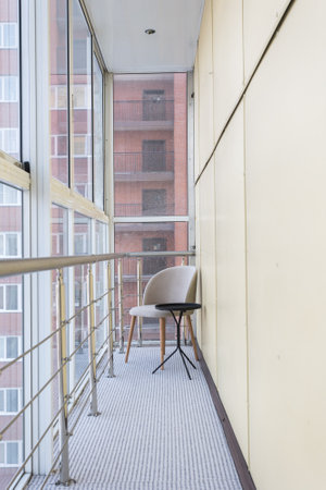 the balcony of an apartment on the upper floors of an apartment buildingの写真素材