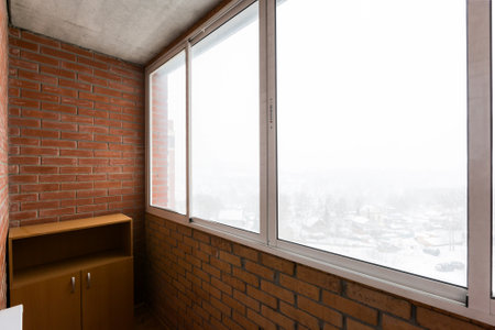 the balcony of an apartment on the upper floors of an apartment buildingの写真素材
