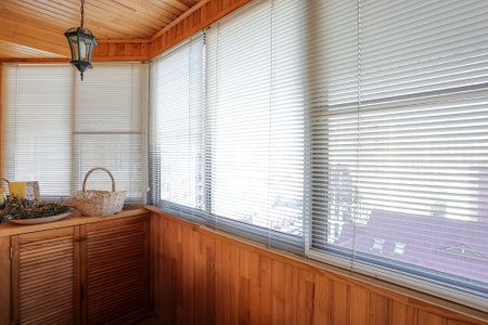 the balcony of an apartment on the upper floors of an apartment buildingの写真素材