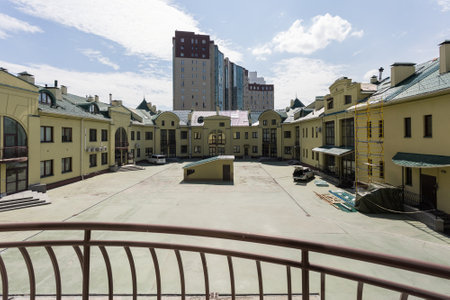 the balcony of an apartment on the upper floors of an apartment buildingの写真素材