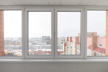 the balcony of an apartment on the upper floors of an apartment buildingの写真素材