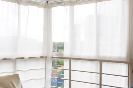 the balcony of an apartment on the upper floors of an apartment buildingの写真素材